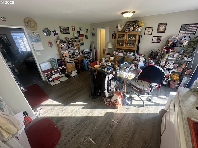 dining space with dark hardwood / wood-style flooring