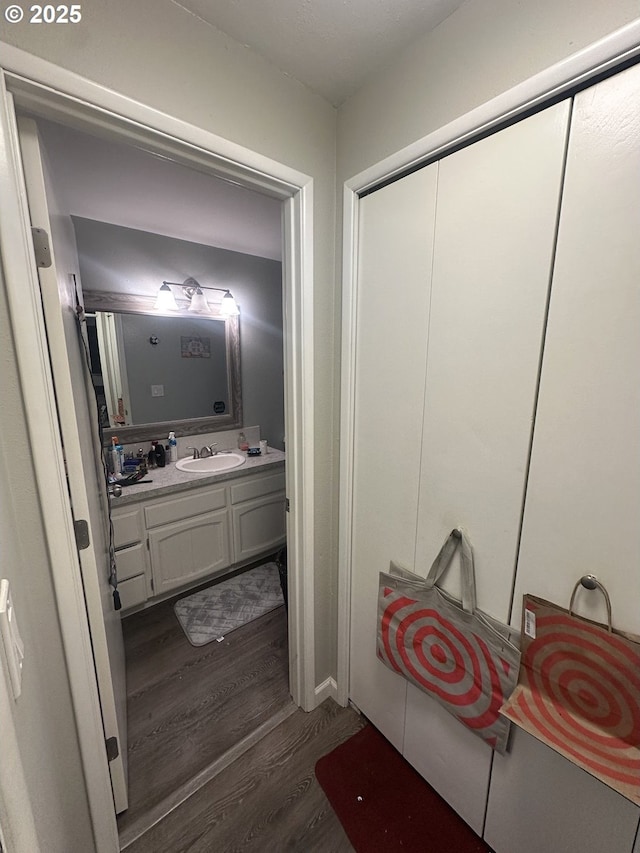 bathroom featuring vanity and hardwood / wood-style flooring