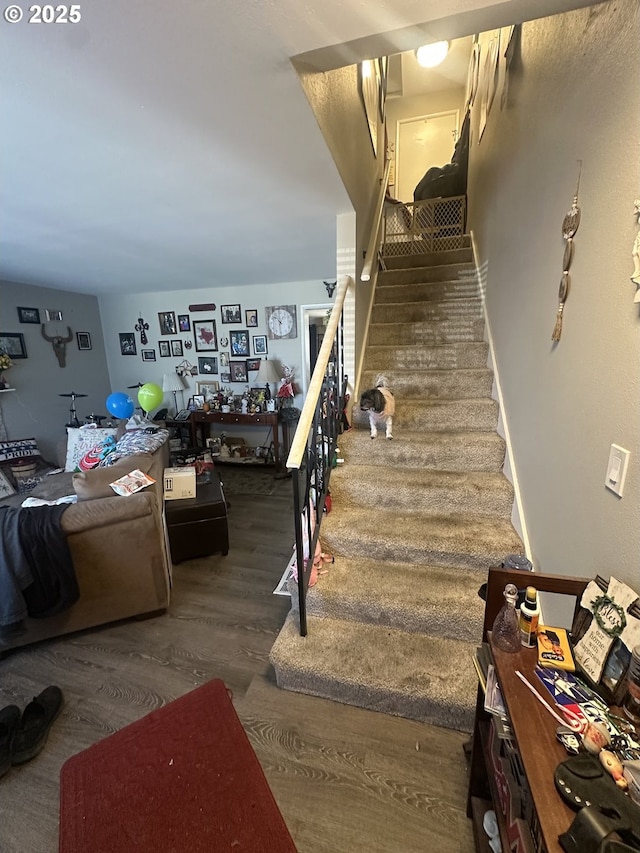 staircase featuring hardwood / wood-style floors