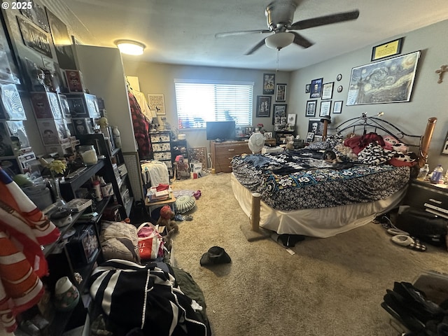 bedroom with ceiling fan and carpet flooring