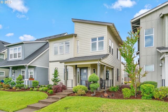 3477 SE Salmonfly Ln, Hillsboro, OR 97123 - view of front facade featuring covered porch and a front lawn