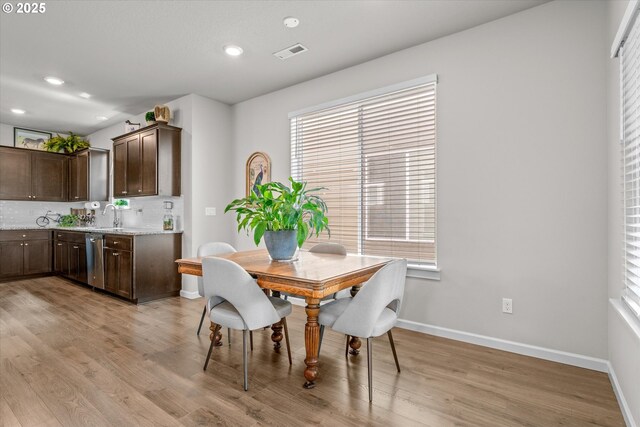 3477 SE Salmonfly Ln, Hillsboro, OR 97123 - dining room with light wood-style floors, recessed lighting, and plenty of natural light