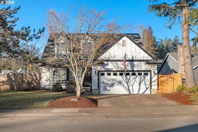 view of front of home with a garage and a front lawn