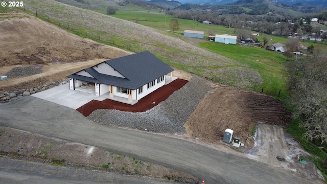 birds eye view of property featuring a rural view