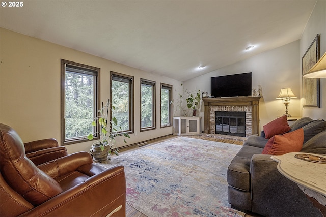 21445 NE Ornduff Rd, Hillsboro, OR 97123 - living room with wood finished floors, healthy amount of natural light, lofted ceiling, and a fireplace