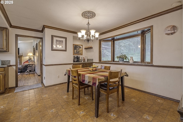 21445 NE Ornduff Rd, Hillsboro, OR 97123 - dining area with a chandelier, ornamental molding, and baseboards
