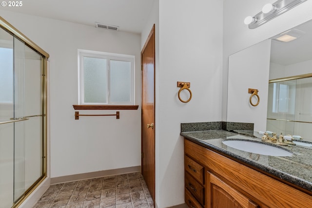 3116 NE 108th Ave, Portland, OR 97220 - full bathroom with vanity, baseboards, and a shower with door