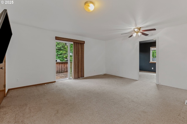 3116 NE 108th Ave, Portland, OR 97220 - empty room with a ceiling fan, healthy amount of natural light, and carpet flooring