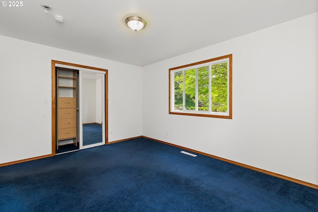 3116 NE 108th Ave, Portland, OR 97220 - spare room featuring baseboards, dark carpet, fire sprinkler in ceiling, and a smoke detector