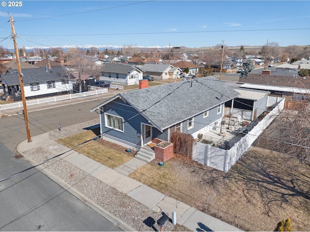 birds eye view of property with a residential view