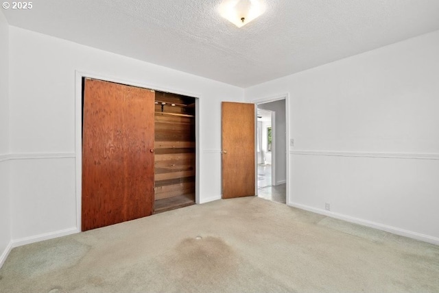 161 1st St, Dillard, OR 97432 - unfurnished bedroom with carpet flooring, a closet, a textured ceiling, and baseboards