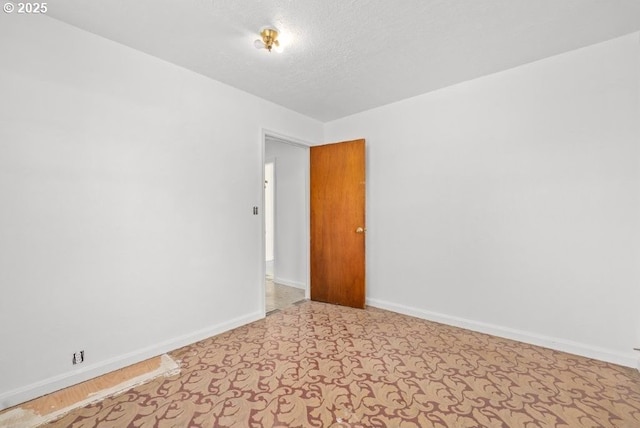 161 1st St, Dillard, OR 97432 - empty room featuring a textured ceiling and baseboards