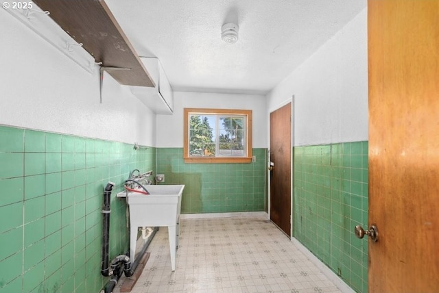 161 1st St, Dillard, OR 97432 - washroom featuring tile walls, light flooring, and wainscoting