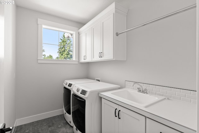 16706 NW Crossvine St, Portland, OR 97229 - laundry room featuring cabinet space, washer and dryer, and baseboards