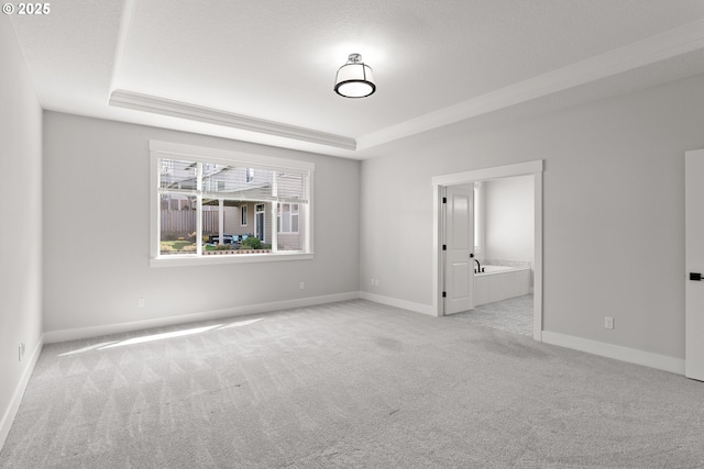 16706 NW Crossvine St, Portland, OR 97229 - empty room featuring a raised ceiling, carpet, baseboards, and crown molding
