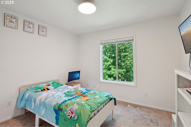 carpeted bedroom with baseboards