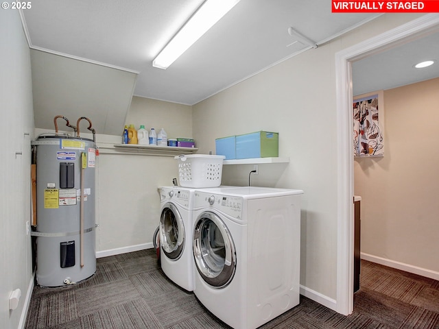 clothes washing area featuring dark colored carpet, washing machine and clothes dryer, and strapped water heater