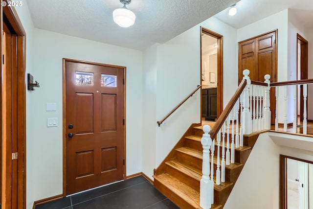 entrance foyer with a textured ceiling