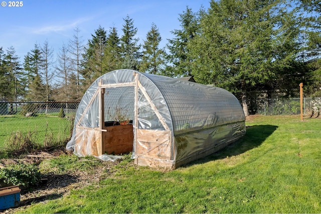 view of outbuilding with a yard