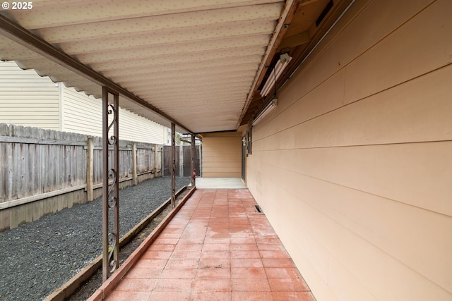 view of patio / terrace featuring fence