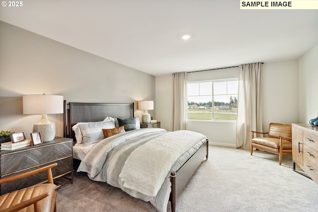 bedroom with baseboards and light carpet