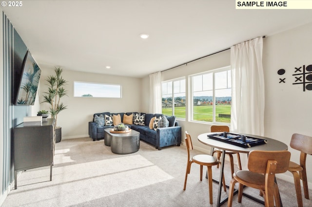 carpeted living room with baseboards and recessed lighting