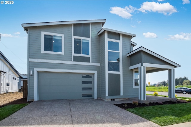 view of front facade with a garage and concrete driveway