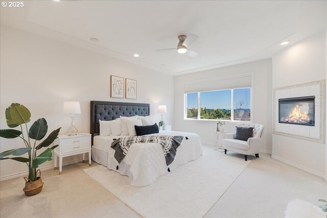 23680 SW Robson Ter, Sherwood, OR 97140 - carpeted bedroom with a ceiling fan, a tiled fireplace, and recessed lighting