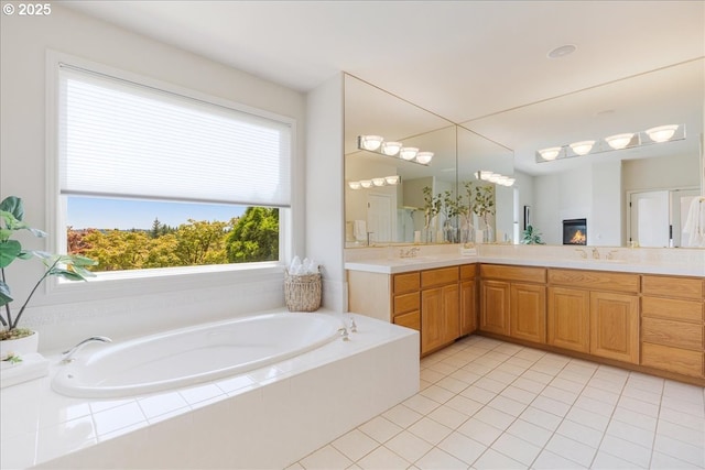 23680 SW Robson Ter, Sherwood, OR 97140 - bathroom with double vanity, a garden tub, and tile patterned floors