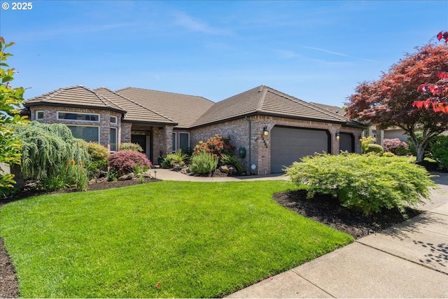 23680 SW Robson Ter, Sherwood, OR 97140 - view of front of home featuring an attached garage, a front lawn, brick siding, and a tiled roof