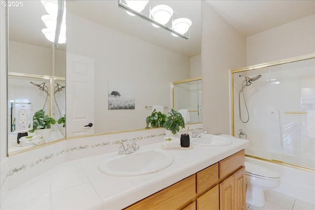 23680 SW Robson Ter, Sherwood, OR 97140 - bathroom featuring double vanity, enclosed tub / shower combo, and tile patterned floors
