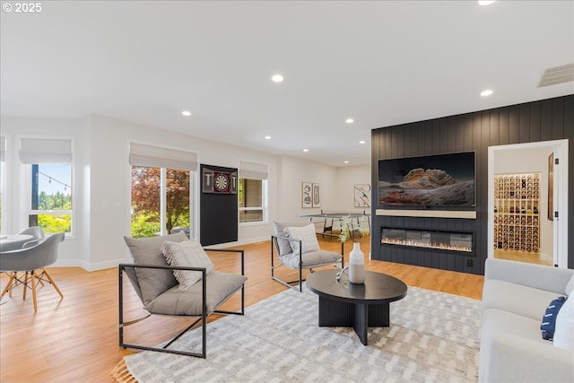 23680 SW Robson Ter, Sherwood, OR 97140 - living room with light wood-style flooring, recessed lighting, and a large fireplace