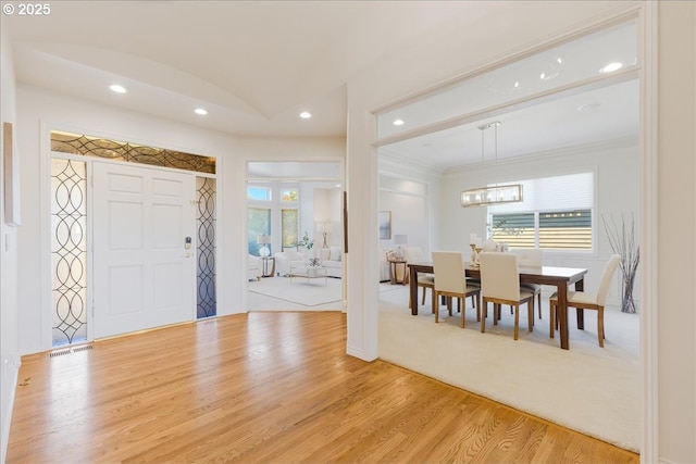 23680 SW Robson Ter, Sherwood, OR 97140 - entrance foyer with light wood finished floors, recessed lighting, a chandelier, and crown molding