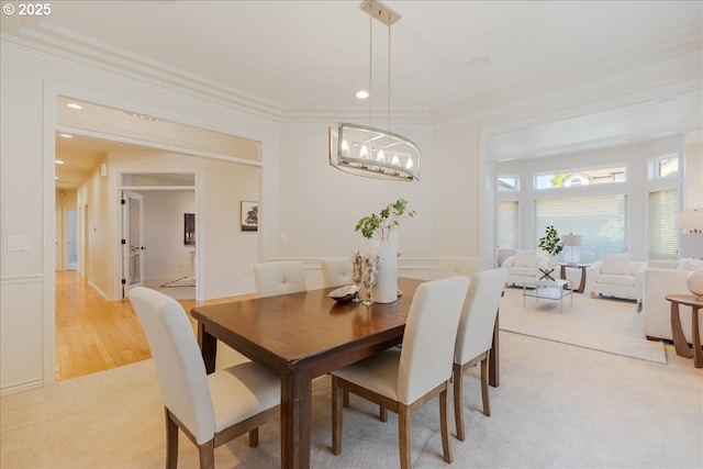 23680 SW Robson Ter, Sherwood, OR 97140 - dining room featuring ornamental molding, a chandelier, light colored carpet, and recessed lighting