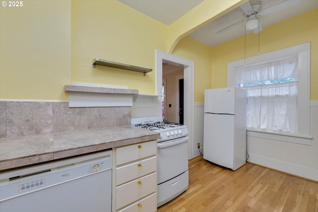 5851 NE 12th Ave, Portland, OR 97211 - kitchen with white appliances, light wood finished floors, wainscoting, ceiling fan, and open shelves