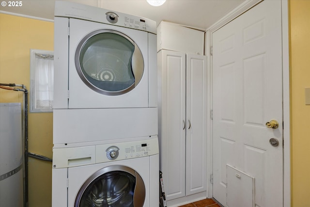 5851 NE 12th Ave, Portland, OR 97211 - laundry area with estacked washer and dryer, cabinet space, and water heater