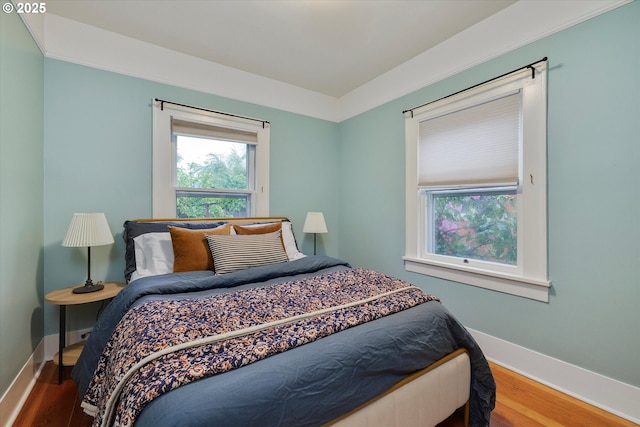 5851 NE 12th Ave, Portland, OR 97211 - bedroom with baseboards and wood finished floors