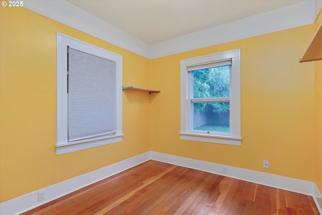 5851 NE 12th Ave, Portland, OR 97211 - unfurnished room featuring baseboards and hardwood / wood-style flooring