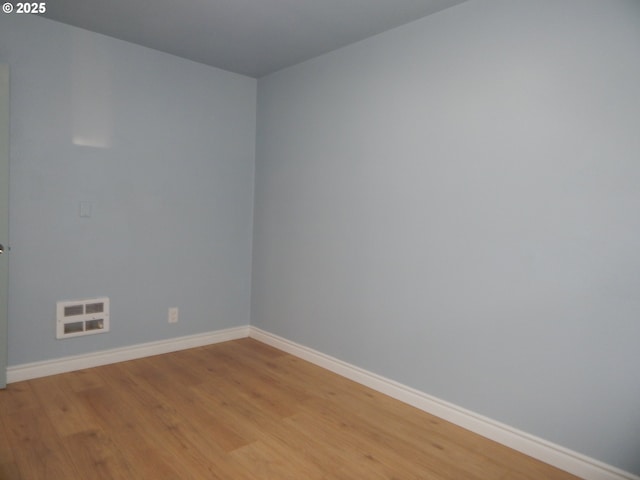1582 N Ivy St, Coquille, OR 97423 - unfurnished bedroom featuring wood finished floors, baseboards, and a closet