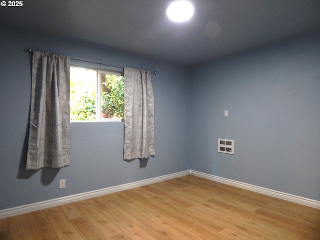 1582 N Ivy St, Coquille, OR 97423 - spare room featuring light wood finished floors and baseboards