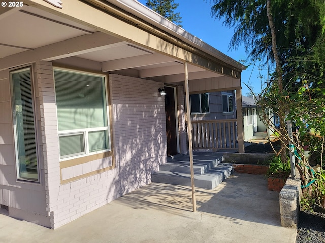 1582 N Ivy St, Coquille, OR 97423 - property entrance with brick siding and a patio area
