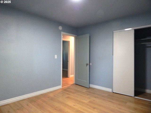 1582 N Ivy St, Coquille, OR 97423 - unfurnished bedroom featuring wood finished floors and baseboards