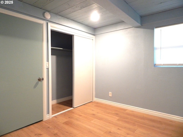 1582 N Ivy St, Coquille, OR 97423 - unfurnished bedroom with a closet, light wood finished floors, and baseboards