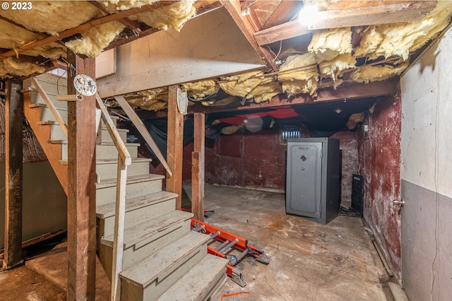 basement featuring stairs