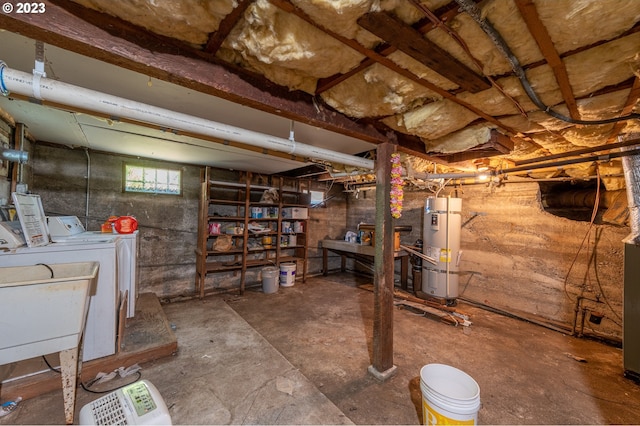 below grade area featuring secured water heater, a sink, and independent washer and dryer