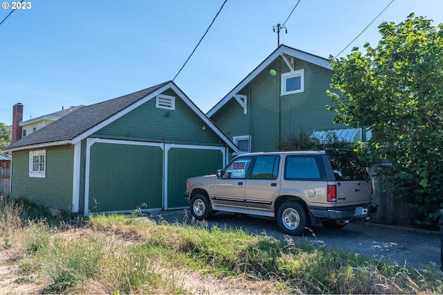 view of property exterior featuring an outbuilding