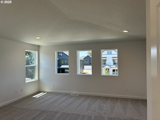 2940 Olympic St Unit 21, Woodburn, OR 97071 - unfurnished room featuring a textured ceiling, carpet, baseboards, and recessed lighting