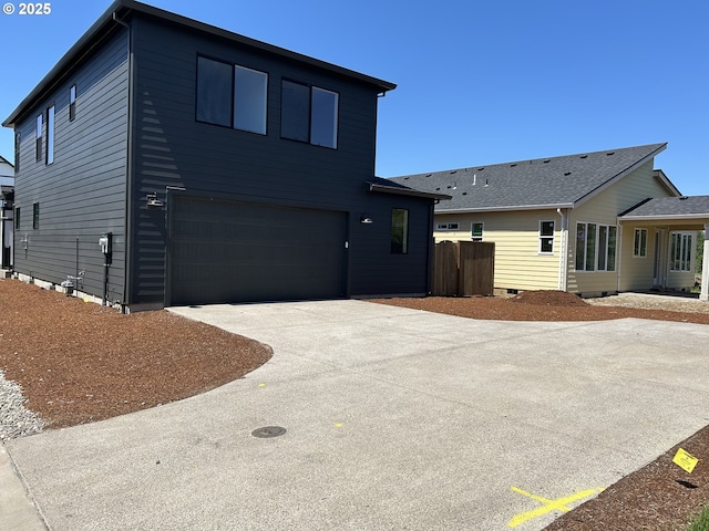 2940 Olympic St Unit 21, Woodburn, OR 97071 - view of front of house with a garage and concrete driveway