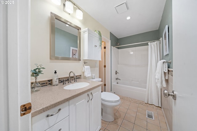 full bathroom featuring toilet, tile patterned flooring, vanity, and shower / bath combo