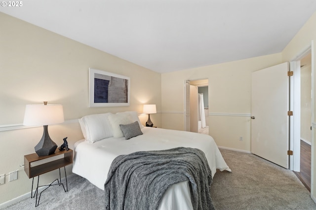 bedroom with carpet floors and baseboards